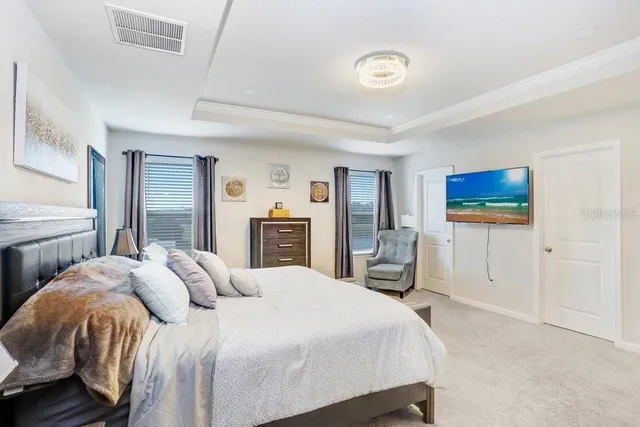 a bedroom with a bed and a dresser