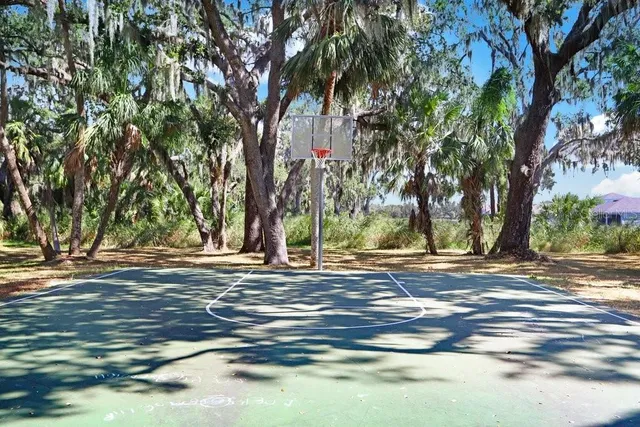 a view of a swimming pool with an outdoor seating