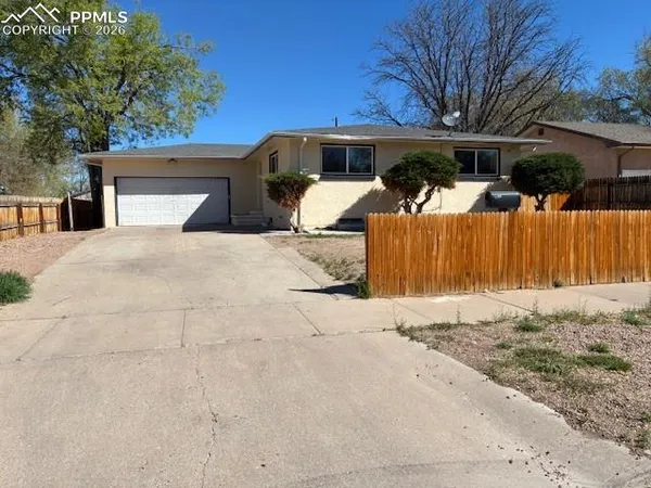 a view of a outdoor space with wooden fence