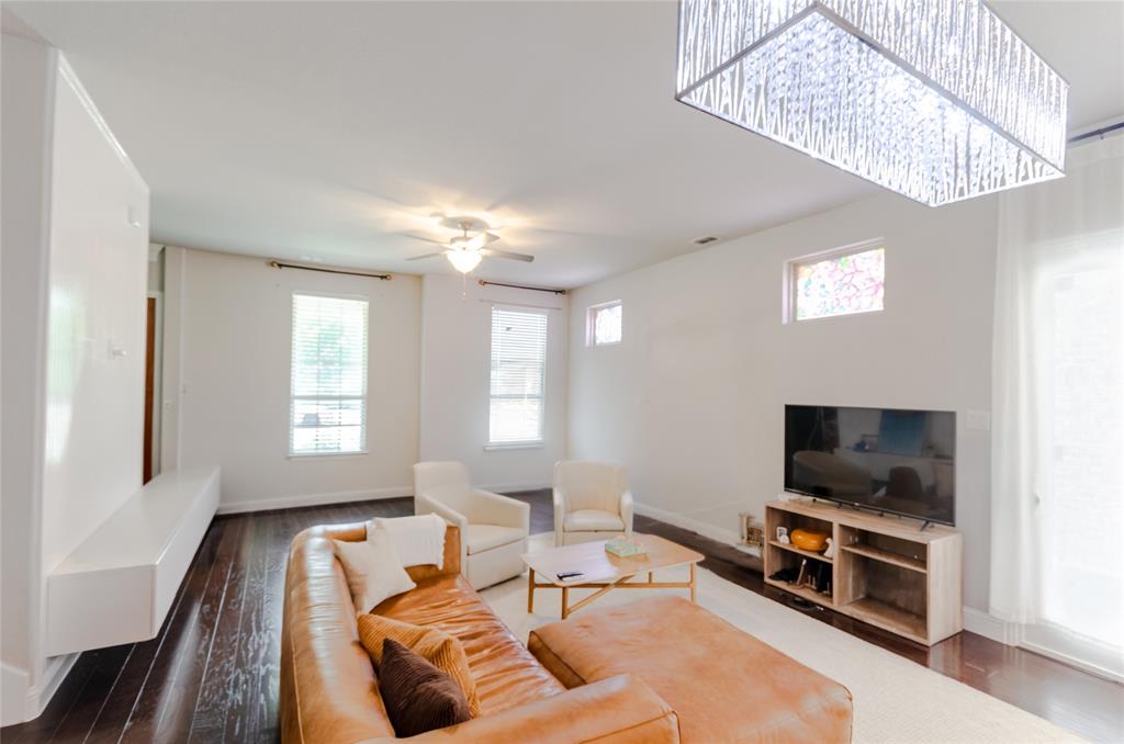 1448 Pebble Way Allen, TX 75013 - Photo 7 of 25 a living room with furniture and a flat screen tv