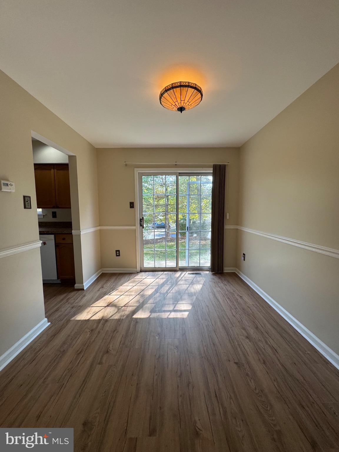 5513 Rinker Circle Doylestown, PA 18902 - Photo 8 of 22 wooden floor in an empty room with a window