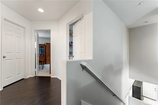 a view of an entryway with wooden floor