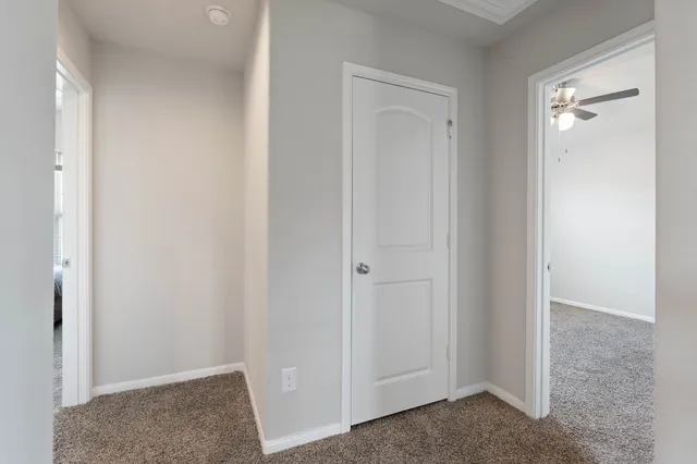 a view of room with hardwood floor and closet