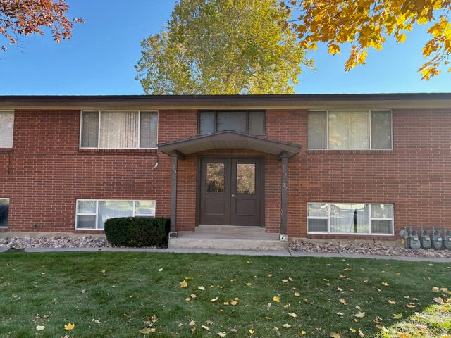 Front of all brick building with two units up and two units on the garden level