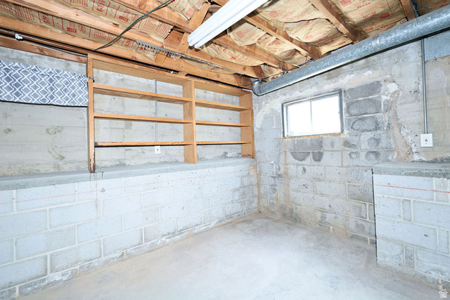 1272 Cook Street Ogden, UT 84404 - Photo 43 of 58 Concrete block walls with an exposed ceiling featuring wood joists and insulation