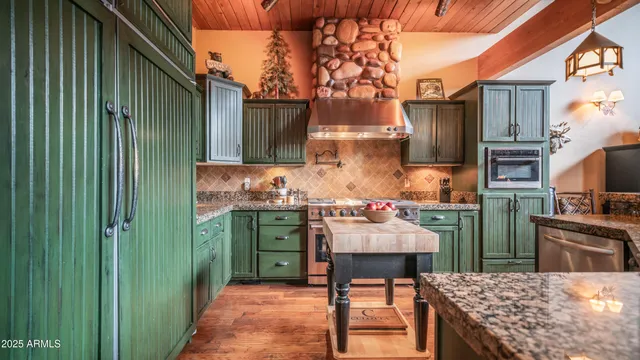 a kitchen with a sink stove and refrigerator