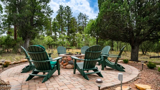 a view of a chairs and table in the patio