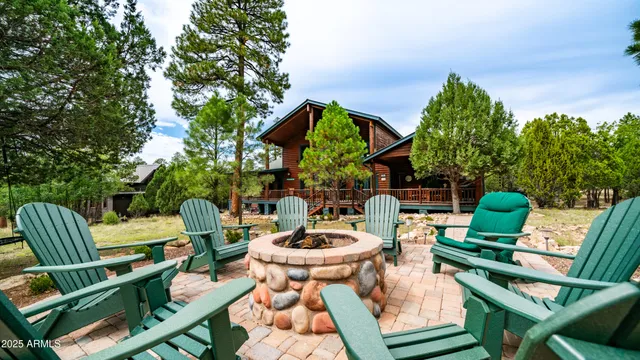 a view of house with a yard and balcony