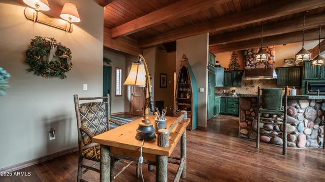 a view of a dining room with furniture and wooden floor