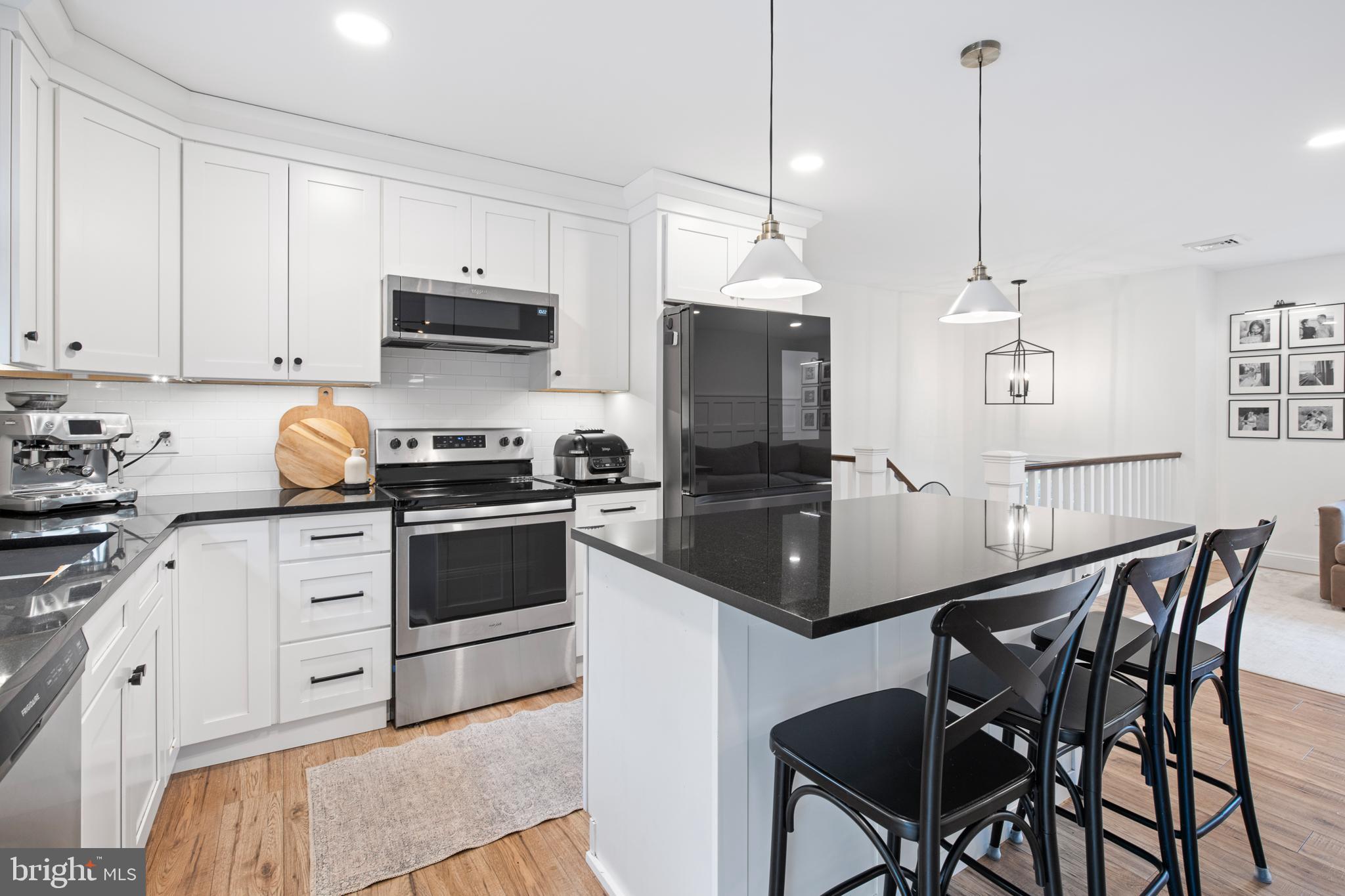 1014 Jeffrey Lane Lititz, PA 17543 - Photo 11 of 41 a kitchen with granite countertop kitchen island white cabinets and stainless steel appliances