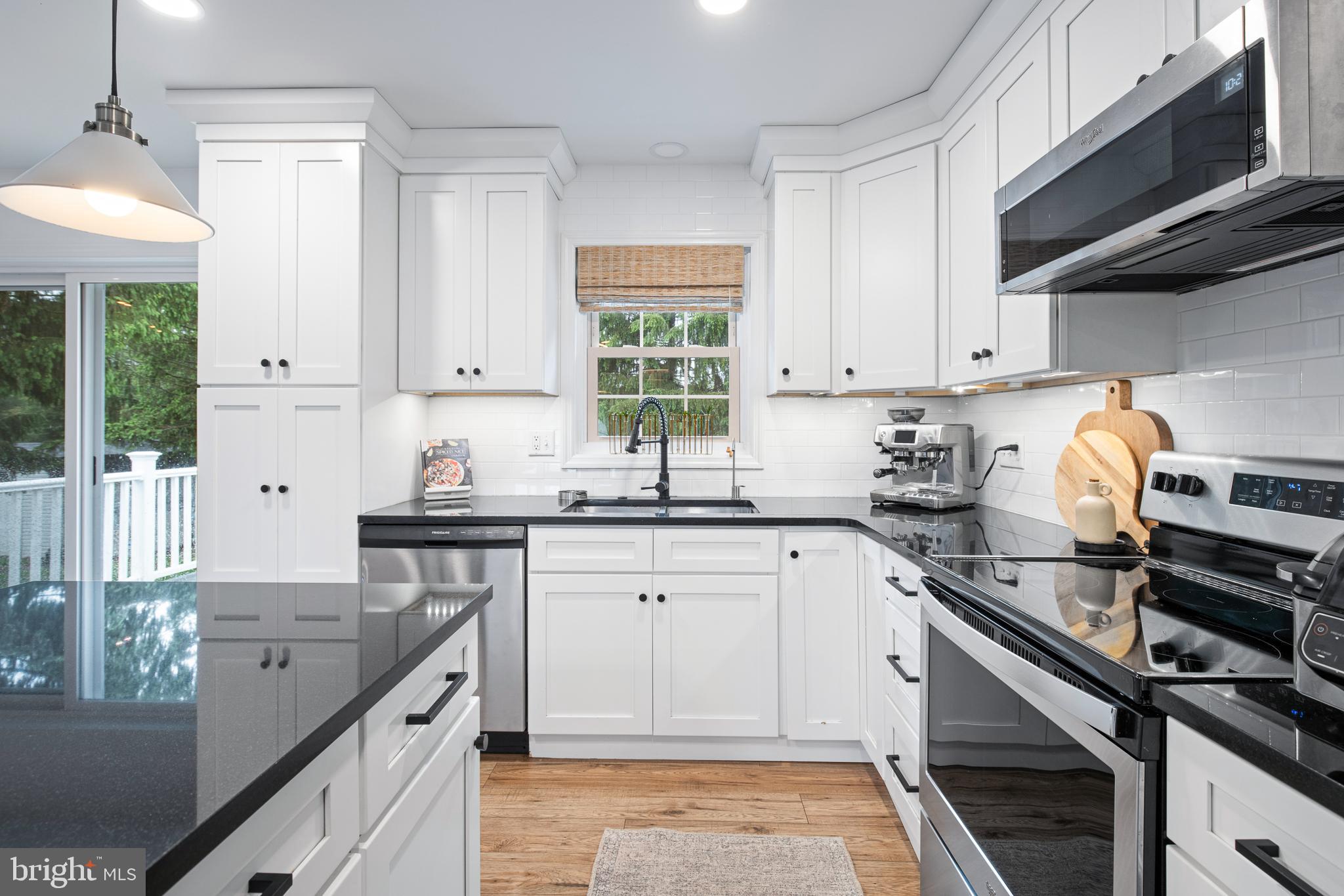 1014 Jeffrey Lane Lititz, PA 17543 - Photo 12 of 41 a kitchen with granite countertop a stove sink and cabinets
