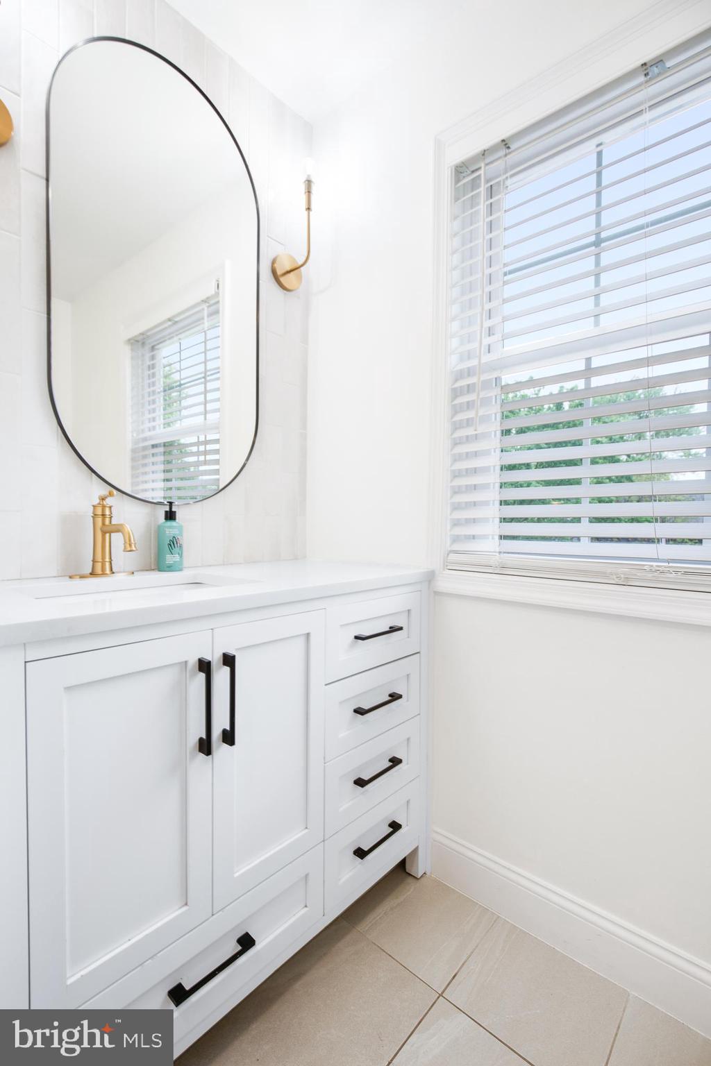 1014 Jeffrey Lane Lititz, PA 17543 - Photo 21 of 41 a bathroom with a sink vanity and a mirror
