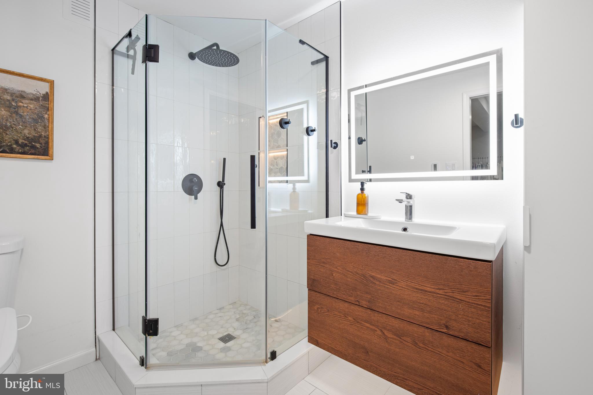 1014 Jeffrey Lane Lititz, PA 17543 - Photo 31 of 41 a bathroom with a shower sink and mirror