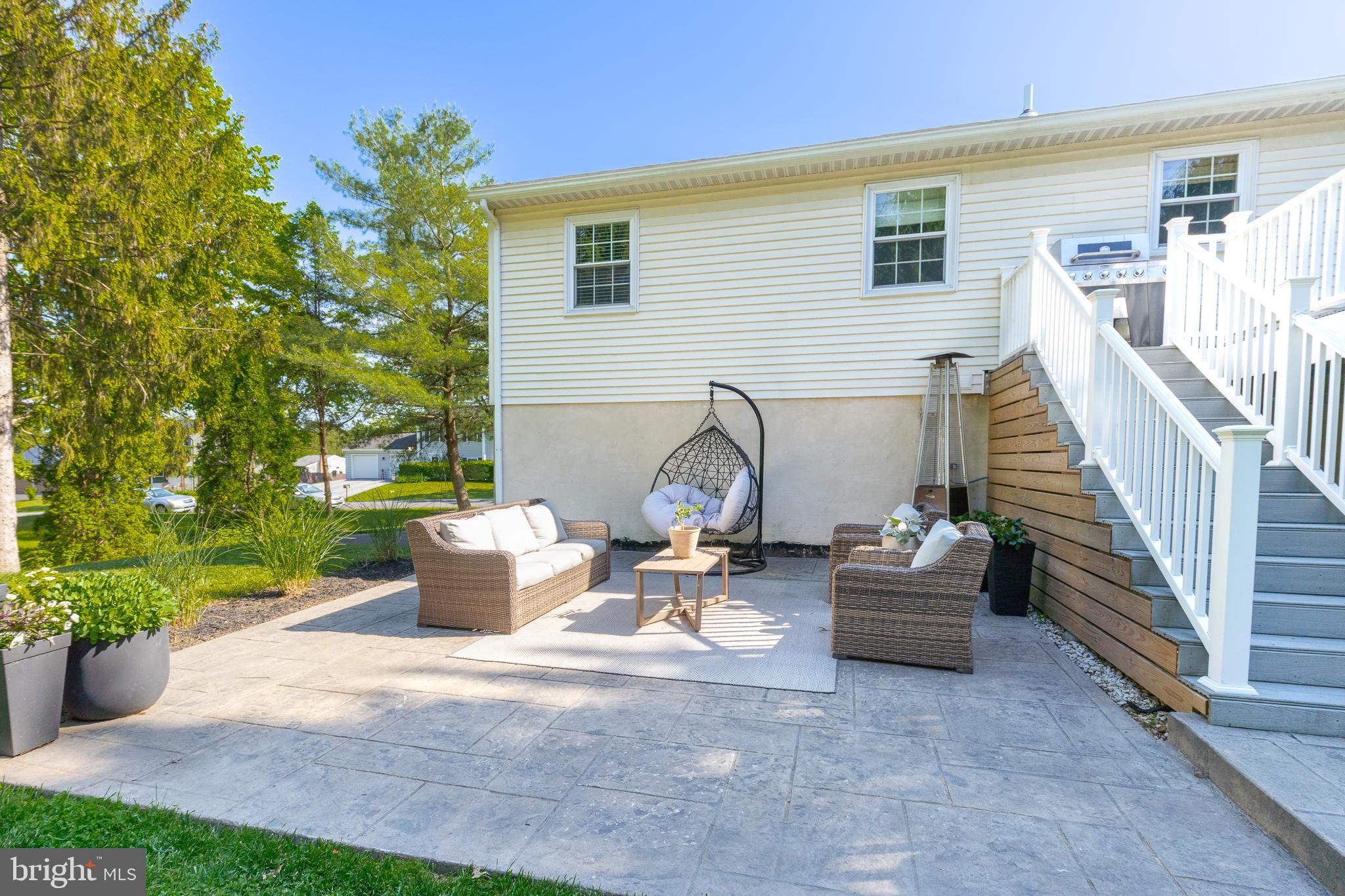 1014 Jeffrey Lane Lititz, PA 17543 - Photo 36 of 41 a view of a patio with dining table and chairs and potted plants