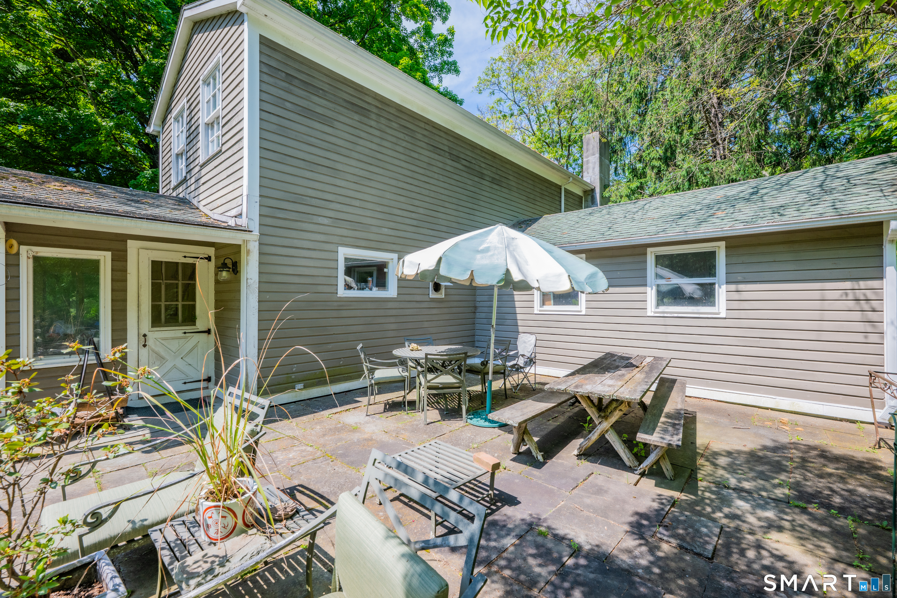 231 B Kent Road Kent, CT 06757 - Photo 21 of 35 a view of backyard with outdoor seating and plants
