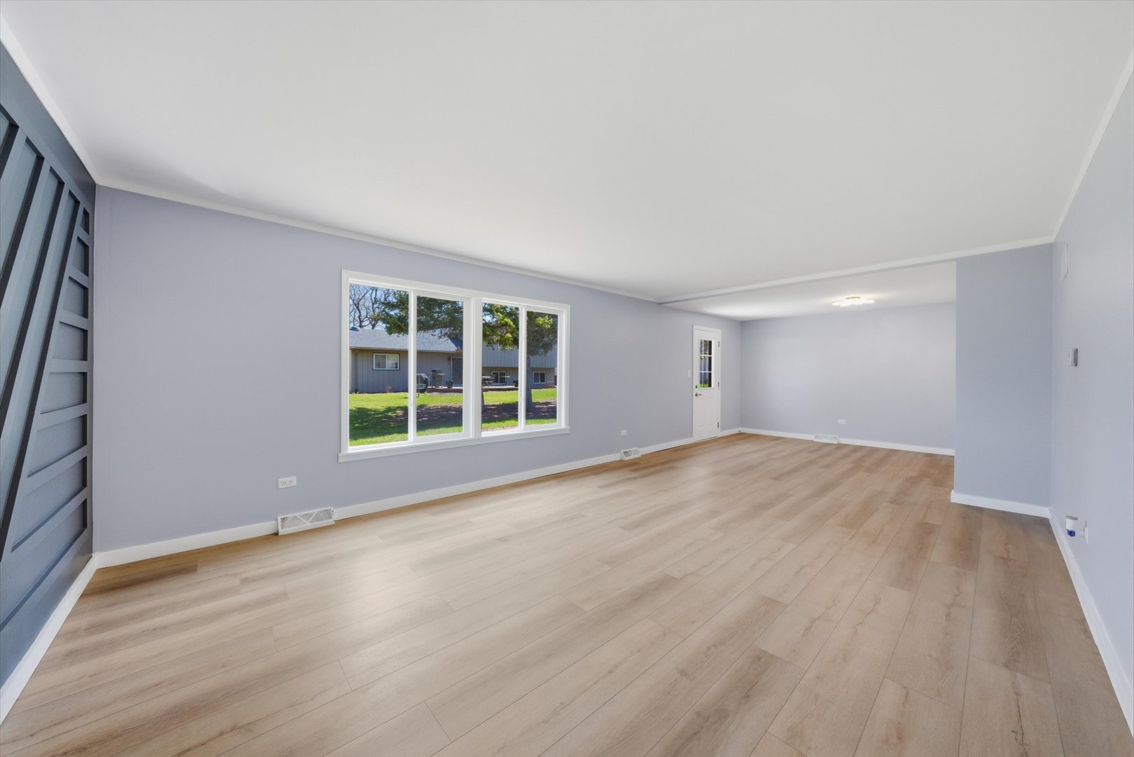 518 Apollo Drive Joliet, IL 60435 - Photo 11 of 25 a view of empty room with wooden floor and fan