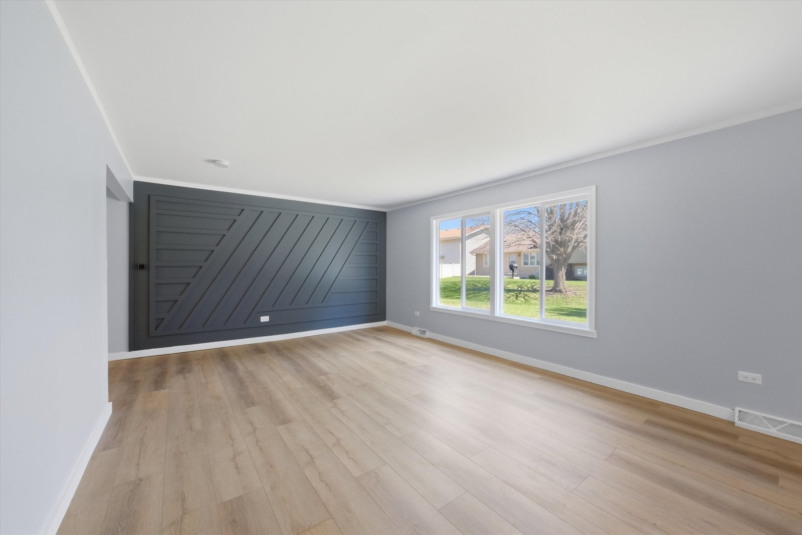 518 Apollo Drive Joliet, IL 60435 - Photo 12 of 25 a view of an empty room with wooden floor and a window