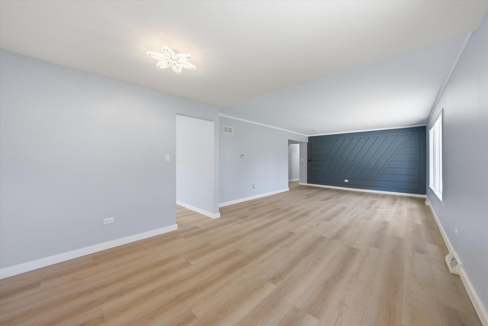 518 Apollo Drive Joliet, IL 60435 - Photo 8 of 25 a view of an empty room with wooden floor
