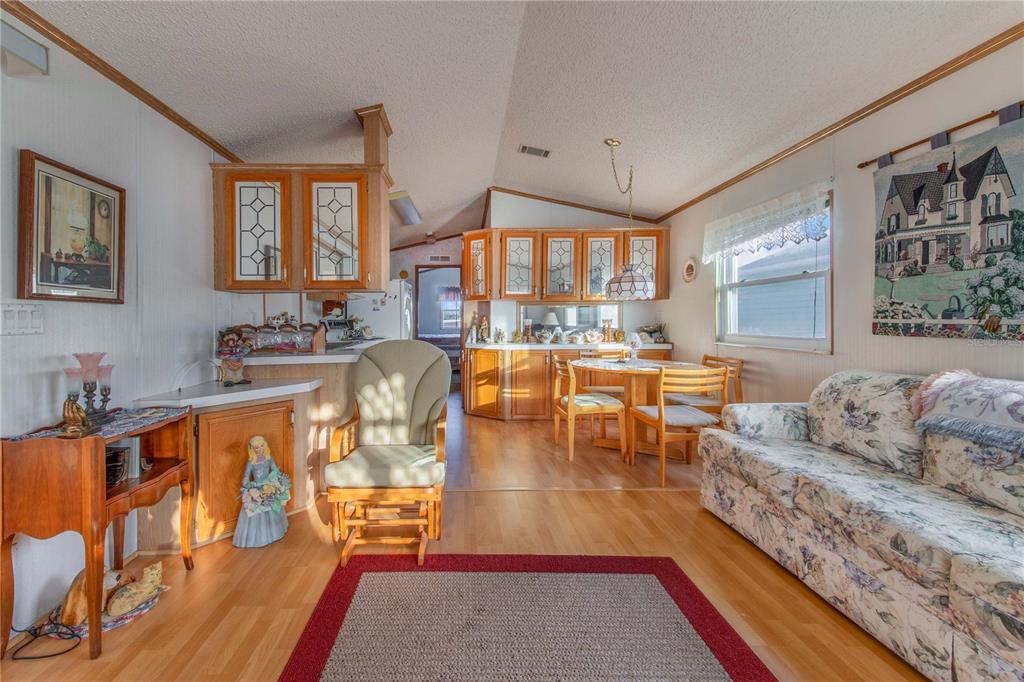251 Patterson Road, Unit F22 Haines City, FL 33844 - Photo 11 of 50 a living room with furniture and a large window