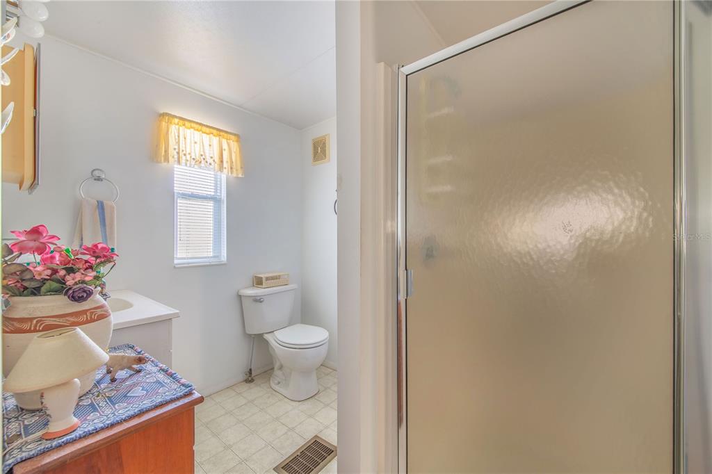 251 Patterson Road, Unit F22 Haines City, FL 33844 - Photo 17 of 50 a bathroom with a sink toilet and window