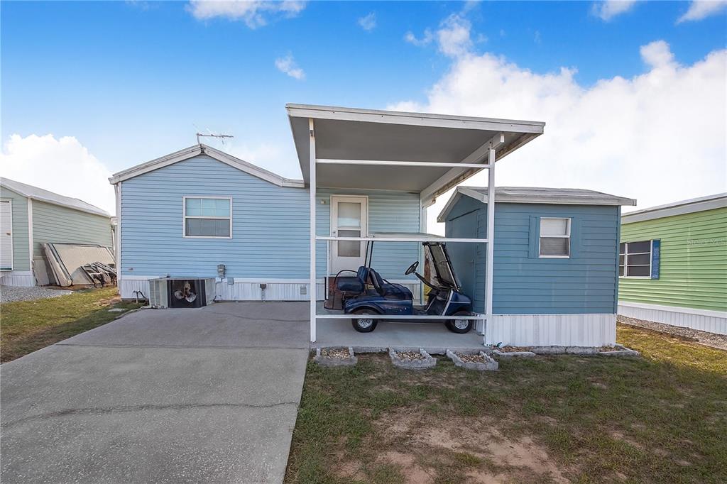251 Patterson Road, Unit F22 Haines City, FL 33844 - Photo 21 of 50 a view of a house with backyard and sitting area
