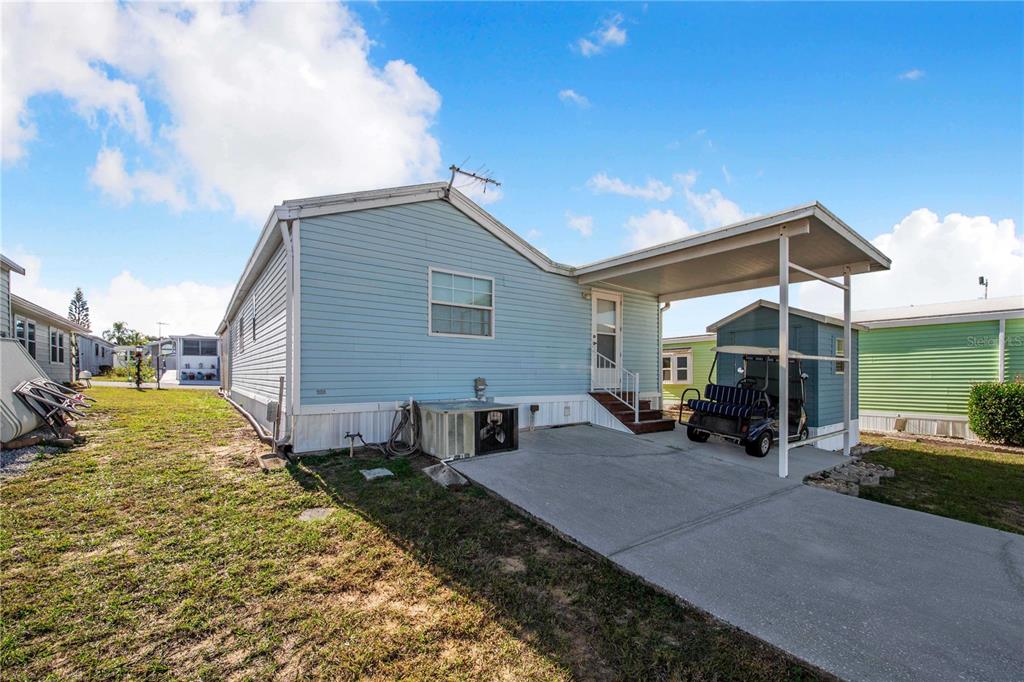 251 Patterson Road, Unit F22 Haines City, FL 33844 - Photo 22 of 50 a view of a house with backyard and porch