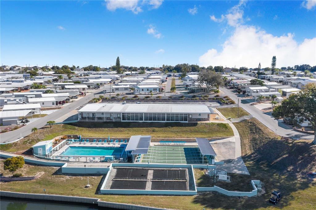 251 Patterson Road, Unit F22 Haines City, FL 33844 - Photo 29 of 50 a view of a swimming pool with outdoor seating and city view
