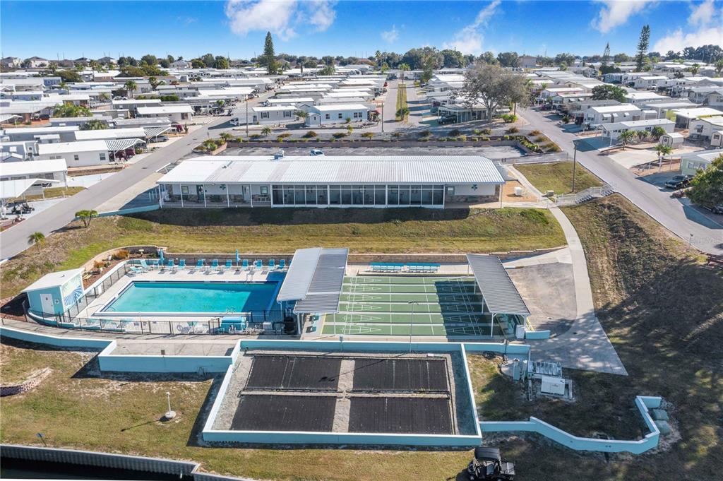 251 Patterson Road, Unit F22 Haines City, FL 33844 - Photo 30 of 50 a view of a swimming pool with a lawn chairs