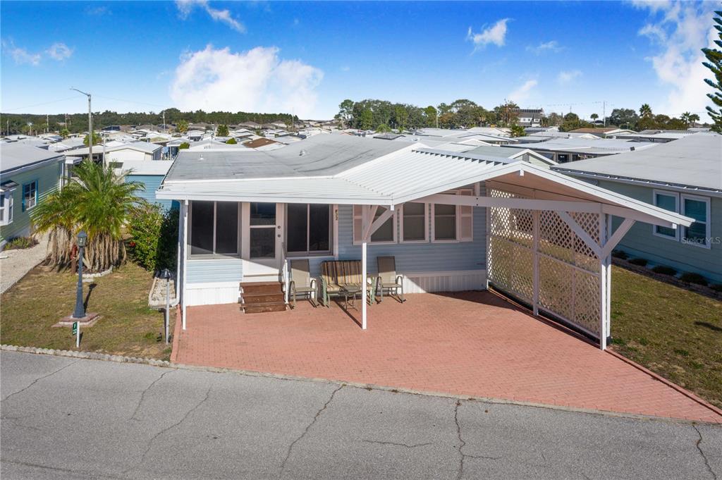 251 Patterson Road, Unit F22 Haines City, FL 33844 - Photo 3 of 50 a view of a patio with a table and chairs