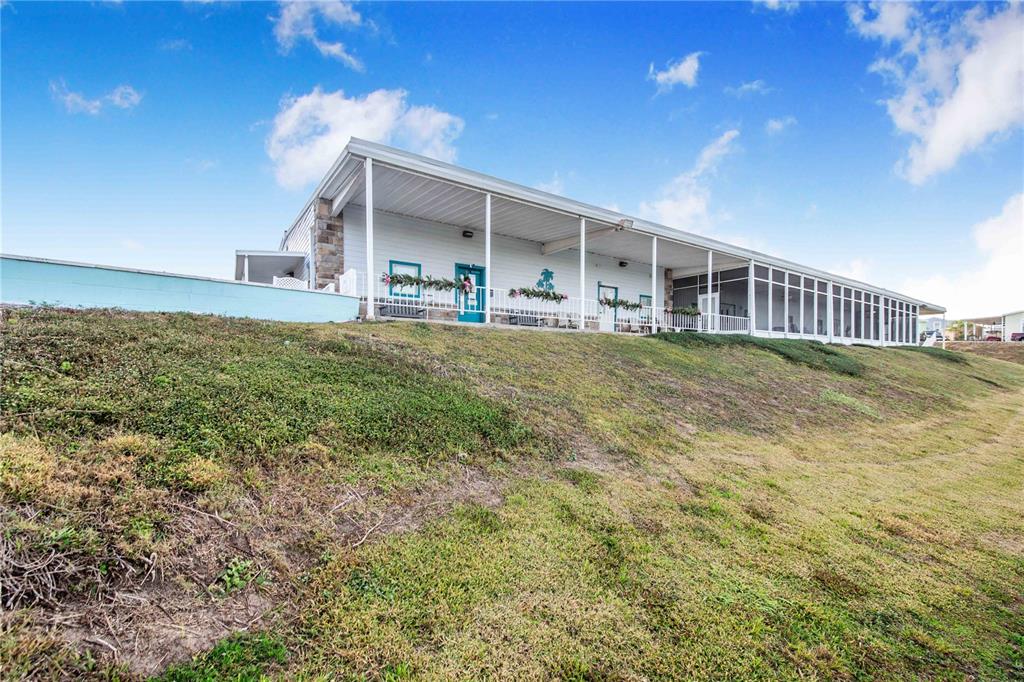 251 Patterson Road, Unit F22 Haines City, FL 33844 - Photo 32 of 50 a view of a house next to a big yard