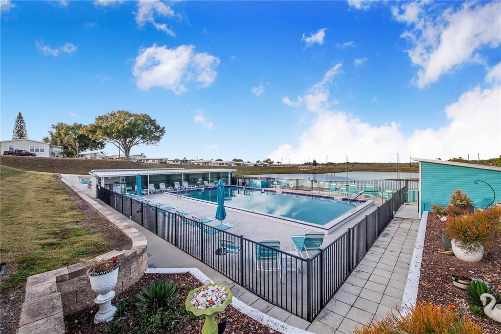 251 Patterson Road, Unit F22 Haines City, FL 33844 - Photo 34 of 50 a view of a balcony with wooden floor & fence