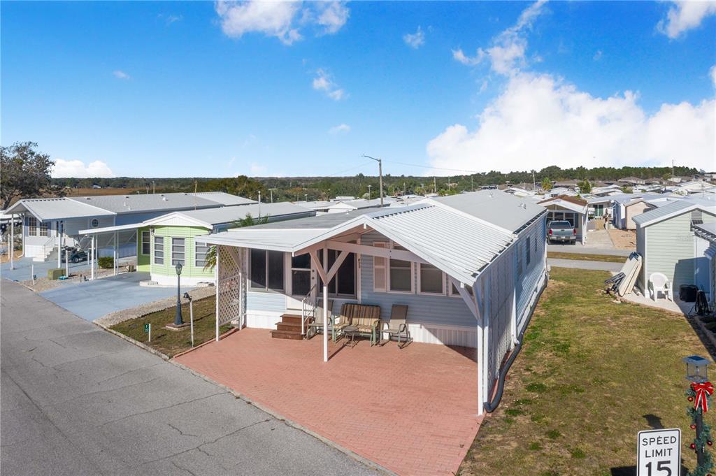 251 Patterson Road, Unit F22 Haines City, FL 33844 - Photo 4 of 50 a view of a house with pool and chairs