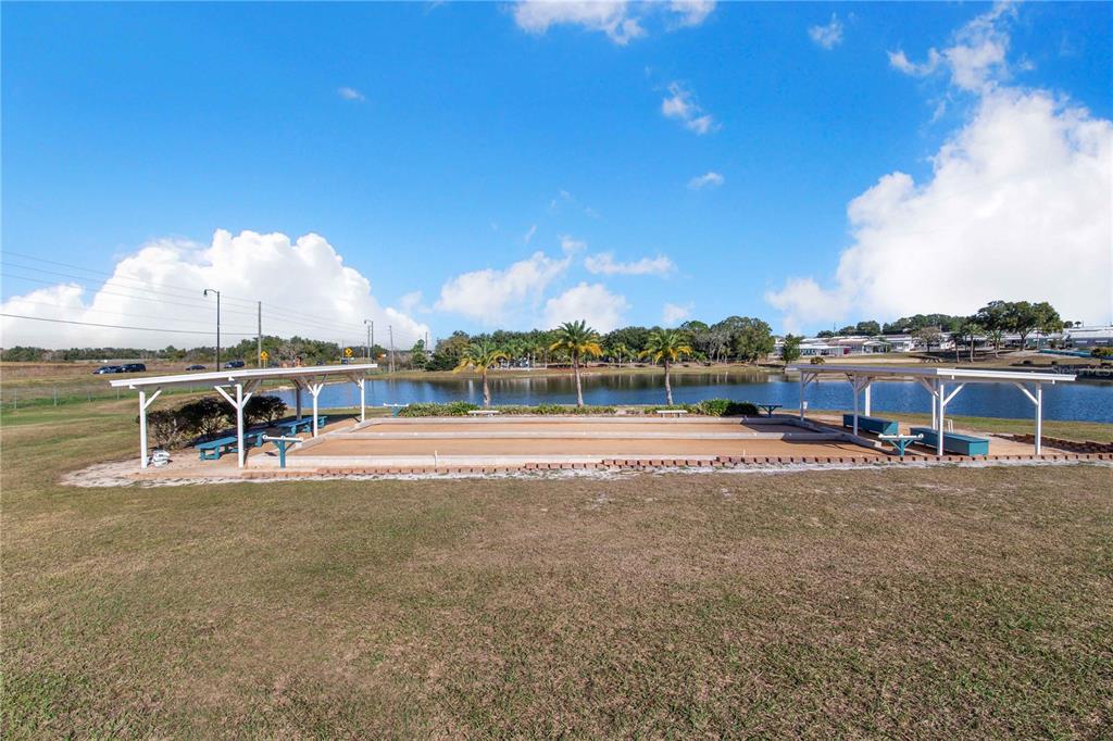 251 Patterson Road, Unit F22 Haines City, FL 33844 - Photo 42 of 50 a view of a swimming pool with an ocean view
