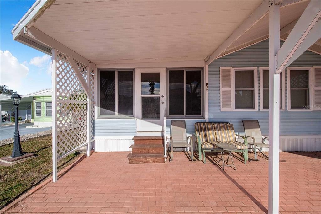 251 Patterson Road, Unit F22 Haines City, FL 33844 - Photo 6 of 50 a view of house with outdoor seating space