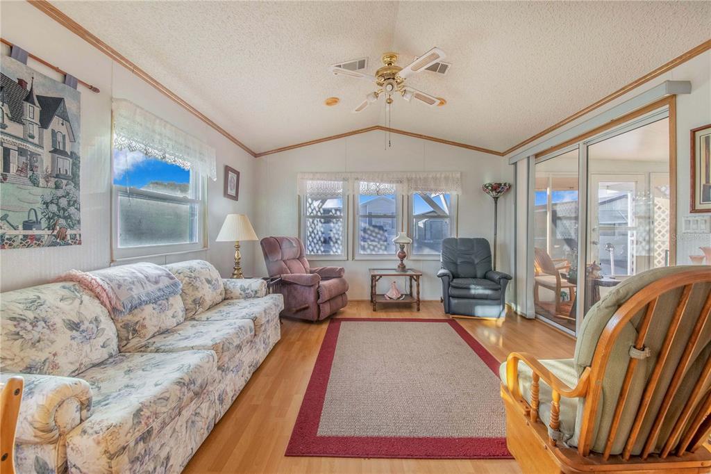 251 Patterson Road, Unit F22 Haines City, FL 33844 - Photo 9 of 50 a living room with furniture and a large window