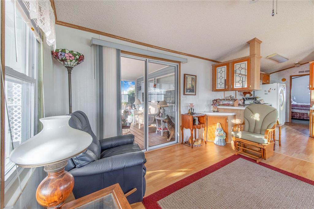 251 Patterson Road, Unit F22 Haines City, FL 33844 - Photo 10 of 50 a living room with fireplace furniture and a large window
