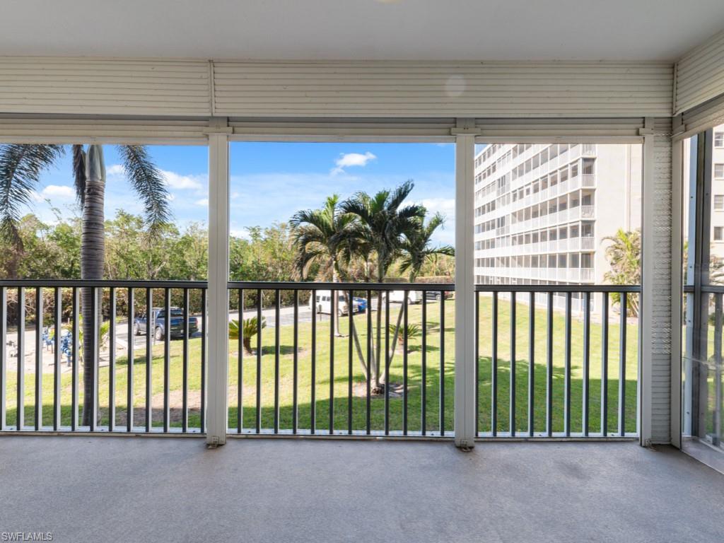 3 Bluebill Avenue, Unit 206 Naples, FL 34108 - Photo 12 of 19 a view of a porch and a porch