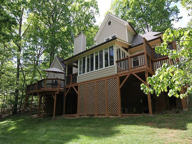12304 Galway Drive Raleigh, NC 27613 - Photo 23 of 25 Sunroom opens onto updated deck with separate covered area with natural gas hook up. Gas grill INCLUDED Exterior Back