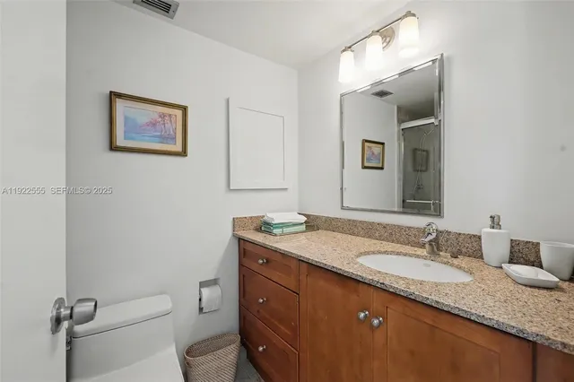 a bedroom with furniture and a book shelf