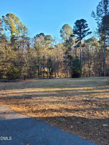 a living room with furniture and a ceiling fan