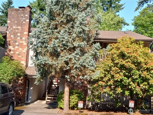 a view of a building with a tree