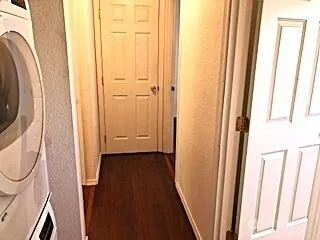 a view of a bathroom from a hallway