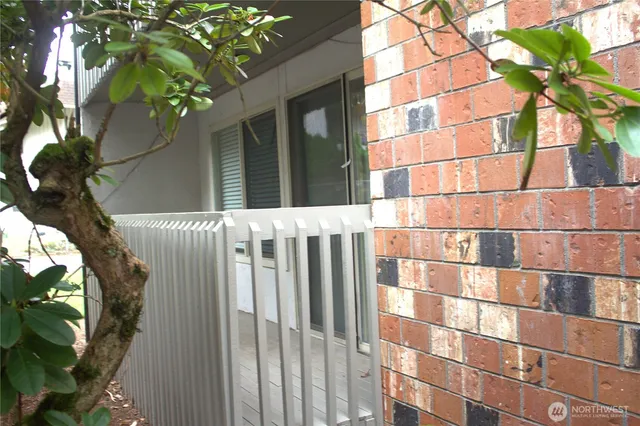 a vase of flowers sitting on a floor