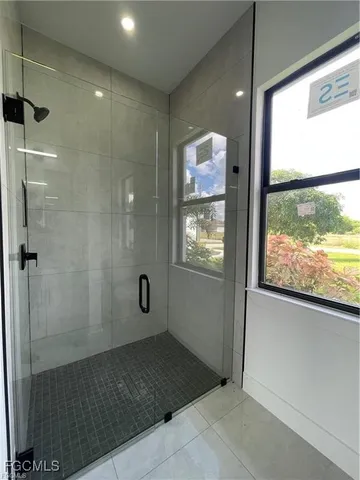 a bathroom with double sink two mirror and a