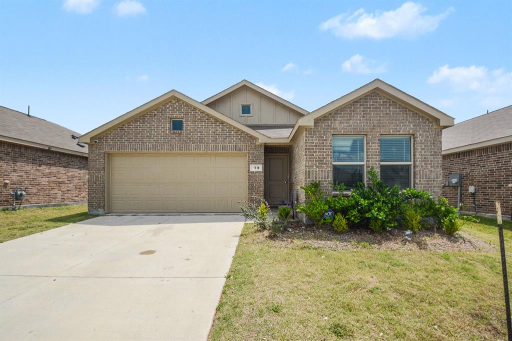 1711 High Perch Lane Forney, TX 75126 - Photo 1 of 16 a front view of a house with garden