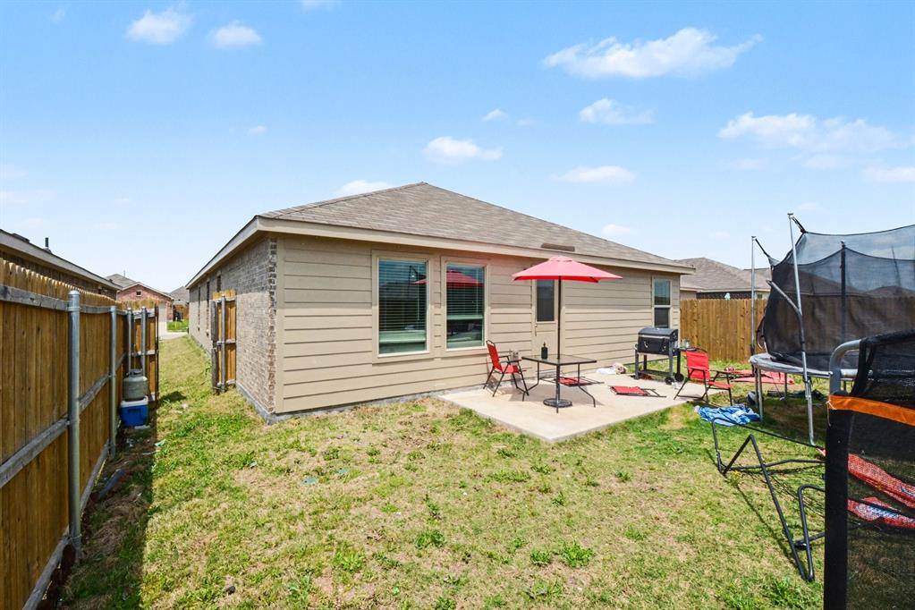 1711 High Perch Lane Forney, TX 75126 - Photo 16 of 16 a backyard of a house with outdoor seating