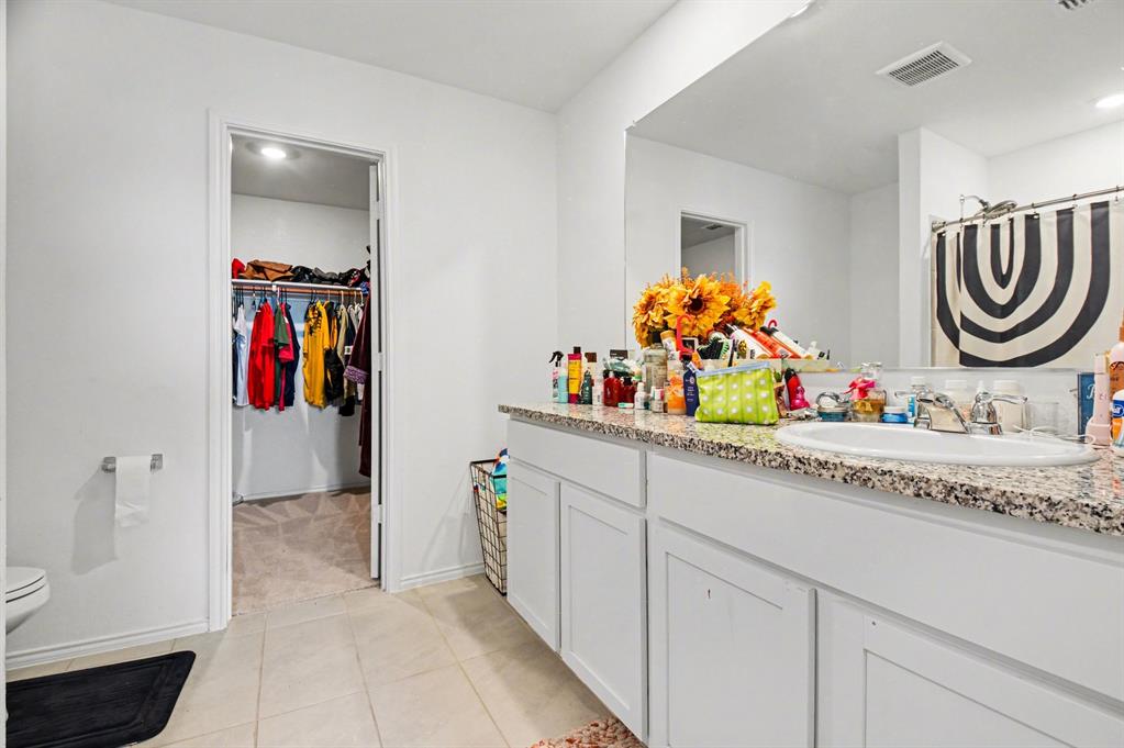 1711 High Perch Lane Forney, TX 75126 - Photo 8 of 16 a view of a hallway with washer and dryer