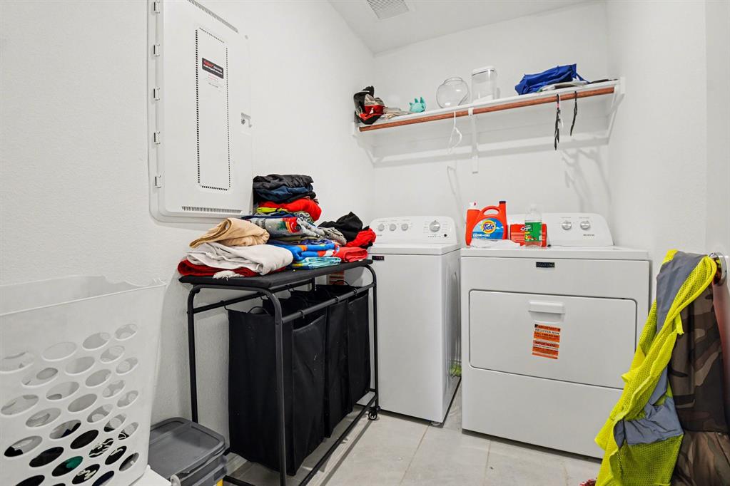 1711 High Perch Lane Forney, TX 75126 - Photo 9 of 16 a utility room with dryer and washer