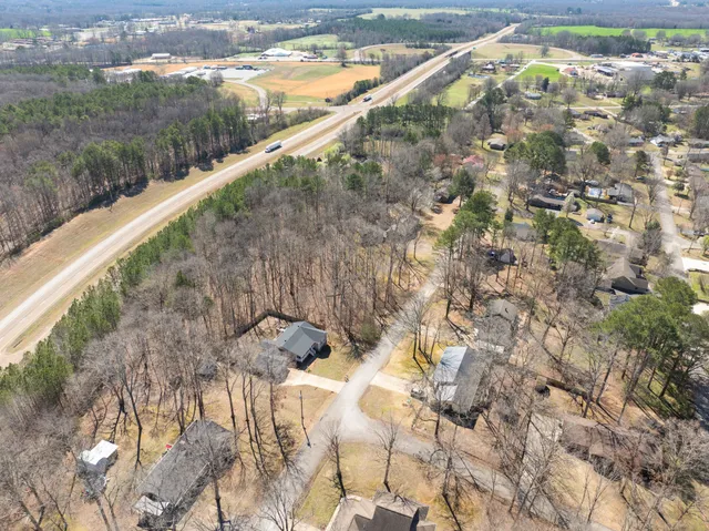 a close up of a wall with a dry yard