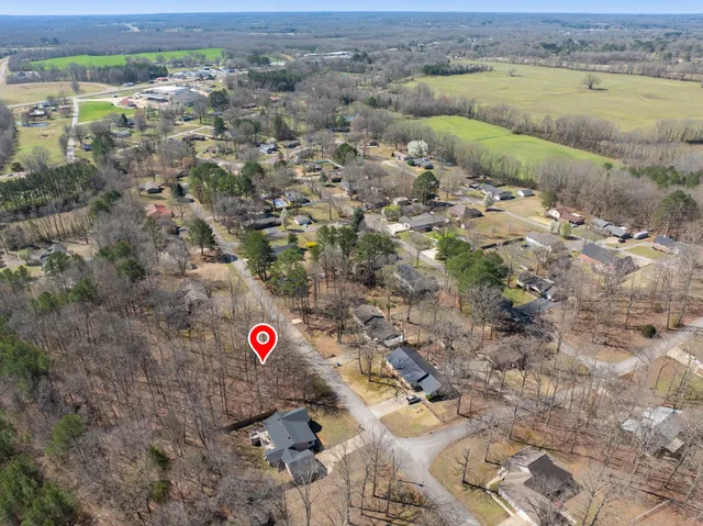 a view of a street with a yard